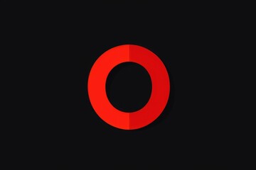 A bright red circle on a dark black background