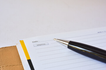 Close up black pen on note book with miscellaneous manual hand writing, highlight, sketch, coloring, binder