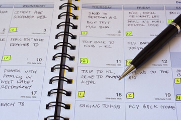 Close up black pen on note book with miscellaneous manual hand writing, highlight, sketch, coloring, binder