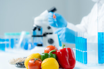 Scientist check chemical food residues in laboratory. Control experts inspect quality of fruits,...