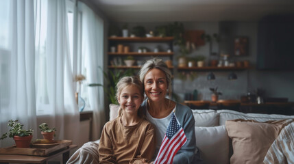 Grandmother and Granddaughter Holding American Flag Together