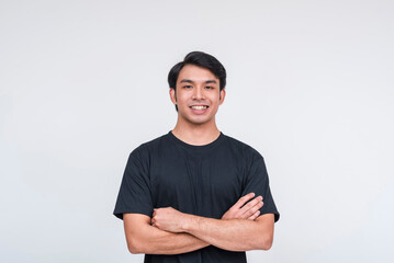 Fototapeta premium Confident asian man in black t-shirt smiling isolated on white