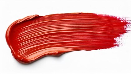 Red lipstick is smeared on a white background, creating a vibrant and bold statement