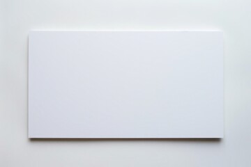 Photo of a blank white foam board sign placed outdoors.
