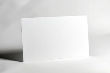 Naklejka premium Blank white paper sign on wooden board with string loop.