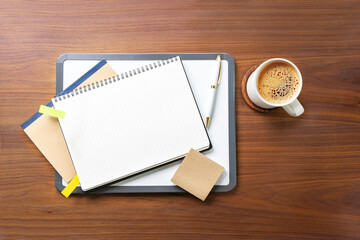 Financial planning blank open page notebook table top still life. Copy space image.