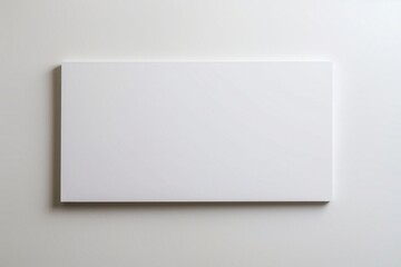 Fototapeta premium A Blank White Rectangular Sign on a Clear Blue Sky