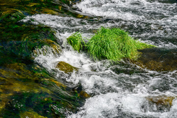Naklejka premium River flowing through rocks photographed with long exposure technique