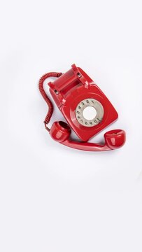 red vintage telephone in vertical