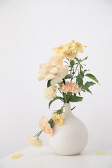 beautiful bouquet in white vase in white interior