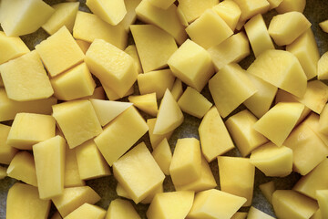 Top view of potatoes being diced for frying
