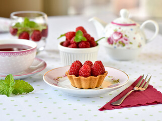 Mini tart with raspberries fruits on the table