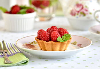 Mini tart with raspberries fruits on the table