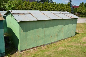 Old tin garage building made of painted sheet metal