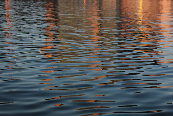 colored reflections on the surface of the lake