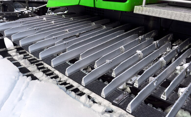 Snowcat machine for snow removal. Preparation ski trails. Snow groomer. Snowy tracks of snowcat in the mountains. Ratrac snowcat. Snow tucker