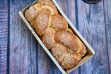  Brioche bread.  Home made easter butter  covered with sugar  on wooden background.