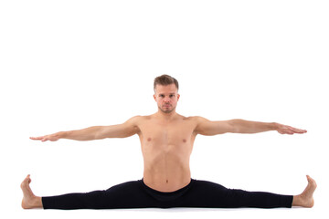 Fitness and Yoga. Healthy lifestyle. Young attractive man posing in the studio. White background.
