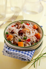 Rice noodles with crab and mushrooms.