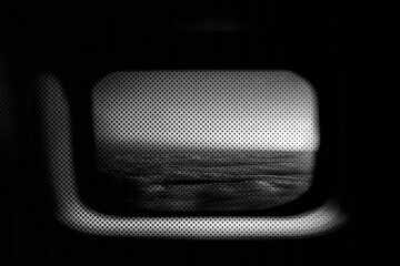 View of a cloudy sky from a plane window