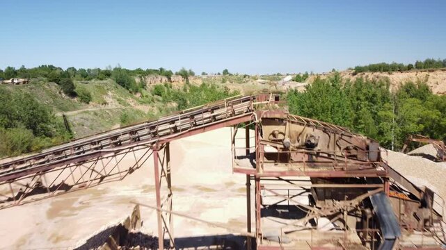 Sand Heaps and a Conveyor Belt at an Old Sand Quarry Close to the Town of Prudnik, Poland - Drone Flying Forward