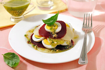 Potato and beetroot salad with basil.