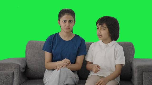 Angry Indian siblings fighting to the camera Green screen