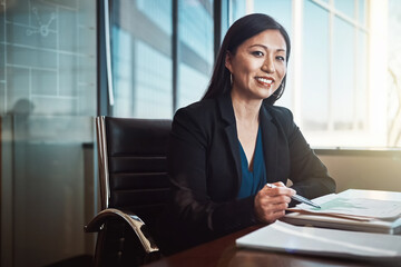 Asian woman, portrait and documents with charts, smile and review for financial data at agency....