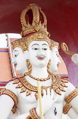 Statue of Hindu deity with multiple faces symbolizes spirituality, faith, and ancient worship