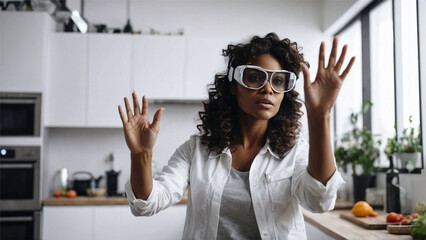 A black woman with AR glasses, controlling virtual screen in the kitchen. Technology and lifestyle.