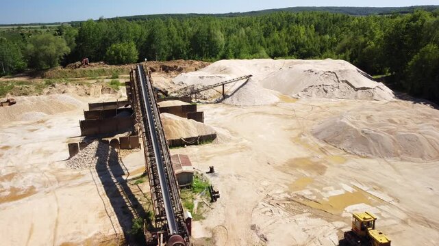 Sand Heaps, Machinery, and Equipment Within an Aged Sand Mine Near the Town of Prudnik, Poland - Aerial Drone Shot