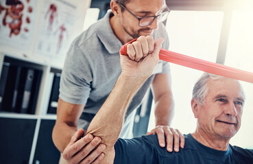 Healthcare, physiotherapist and old man with resistance band, stretching and senior care...