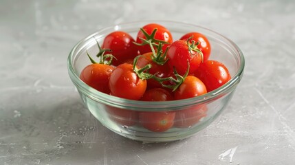 Sweet cherry tomatoes in a glass bowl