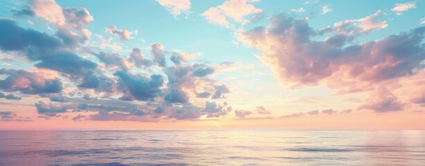 The sunset sky is a beautiful blue and pink color, with beautiful colors over the sea.