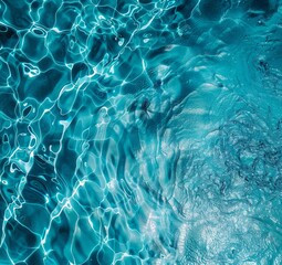 Obraz premium Image of natural transparent water with a blueish tint and small chaotic waves on its surface.