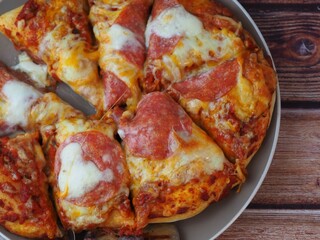 home made deep pan salami pizza 