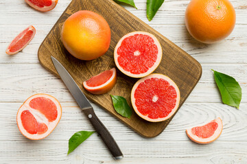 fresh Fruit grapefruit slices on colored background. Top view. Copy Space. creative summer concept. Half of citrus in minimal flat lay with copy space