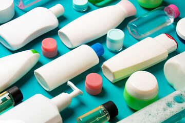 Group of plastic bodycare bottle Flat lay composition with cosmetic products on colored background empty space for you design. Set of White Cosmetic containers, top view with copy space