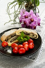 Home baking - sweet poppy seed strudel with cherries,
afternoon dessert with tea or coffee.