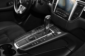 Gear stick inside of modern black car