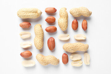 Fresh peanuts on white background, flat lay