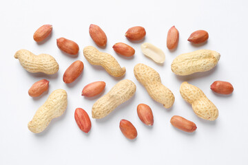 Fresh peanuts on white background, flat lay