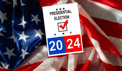 Politics and voting concept. Presidential election 2024 text on white paper over the American flag...