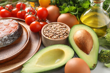 Many different healthy food on white table, closeup