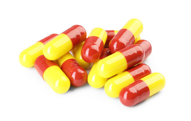 Many antibiotic pills isolated on white. Medicinal treatment