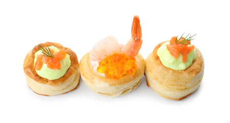 Different delicious puff pastry snacks isolated on white