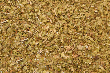 Flat lay of Oregano texture background. Oregano is a common garnish for pizzas, sauces, vegetable and meat dishes. Has a strong fragrance.