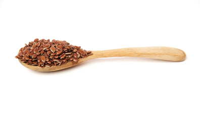 Side view of Brown flax seed on wooden spoon isolated on white background. Brown Flax Seed is rich in nutrients such as dietary fiber and essential fatty acids that are beneficial to the body.