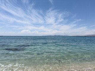 calm sea under blue sky in a sunny summer day