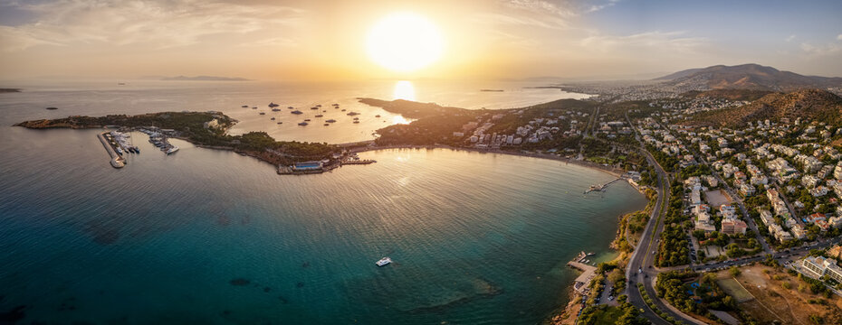 Panoramic aerial view of the bay and beach of Vouliagmeni, south Athens, reece, during a golden summer sunset